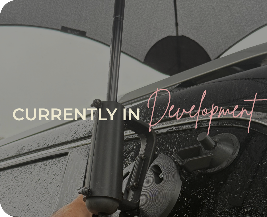 Prototype of the Dry Transfer Umbrella. All black umbrella to transfer your child from the car in the rain without getting wet. 